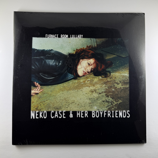 Album cover for 'Furnace Room Lullaby' by Neko Case & Her Boyfriends with a person lying on the ground.
