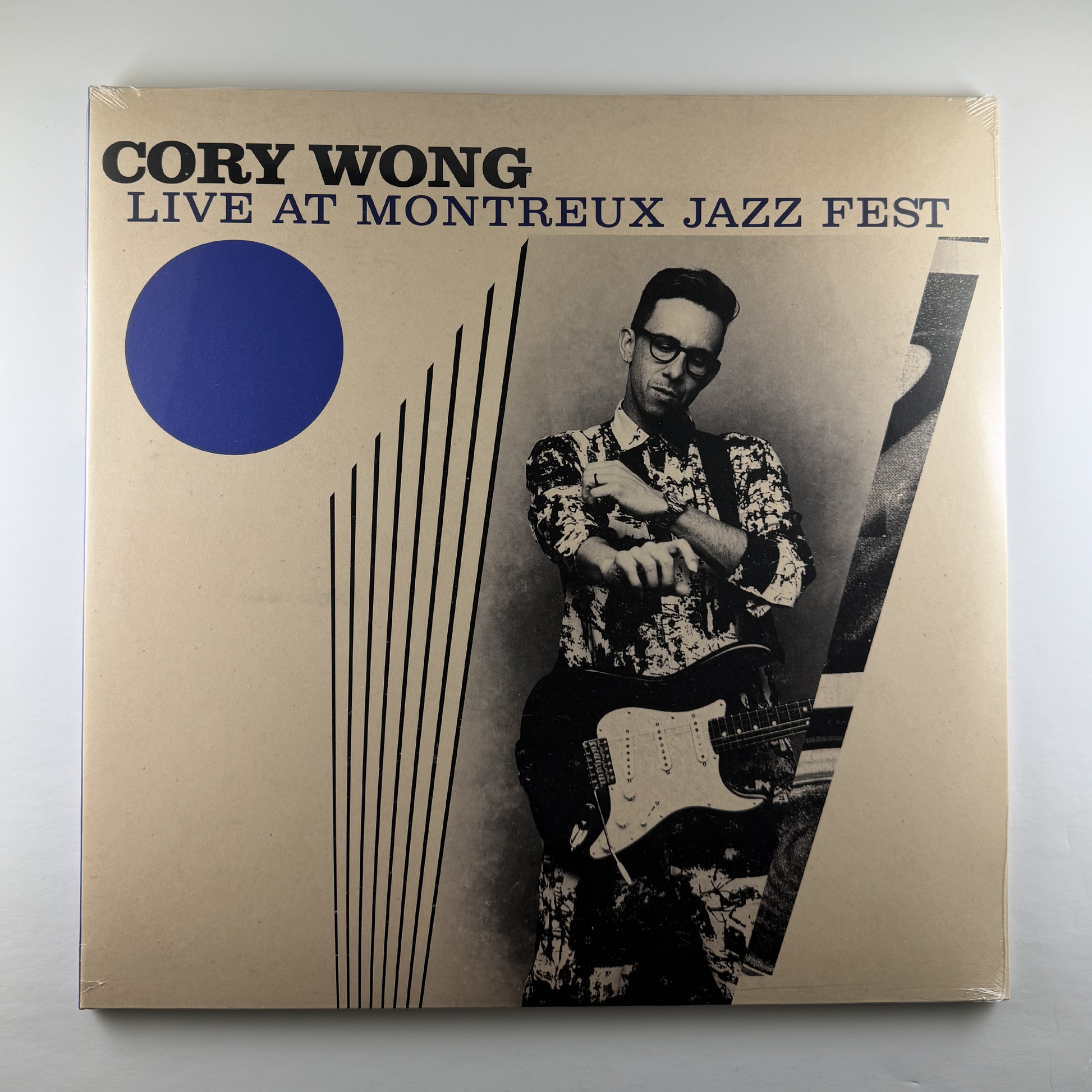 Vinyl record cover for 'Cory Wong Live at Montreux Jazz Fest' with a black and white photo of a man playing guitar.