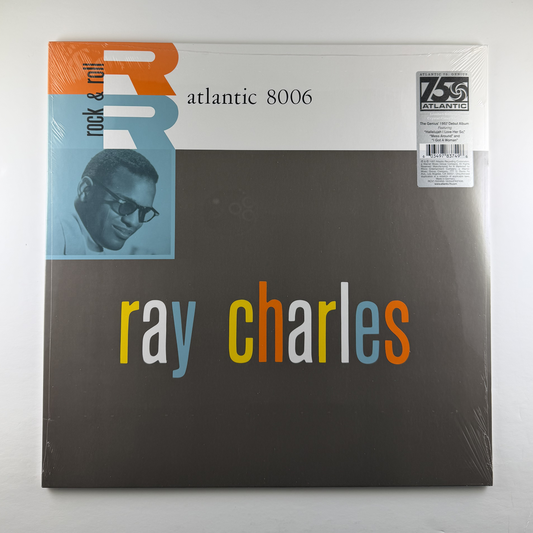 Vinyl record cover with 'Ray Charles' text and a portrait on a white background