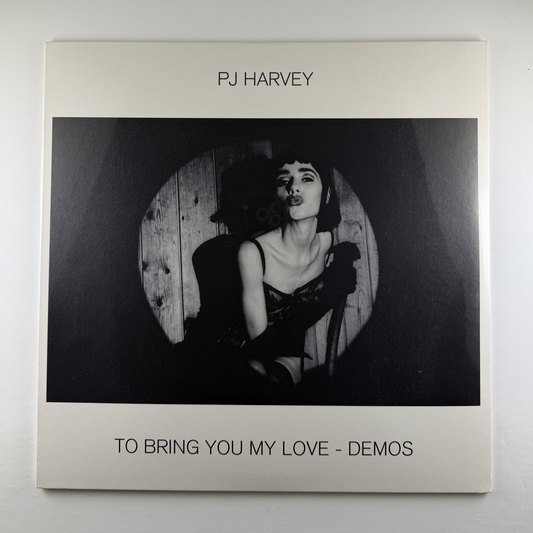 Album cover of PJ Harvey's 'To Bring You My Love - Demos' with a black and white photo of the artist.